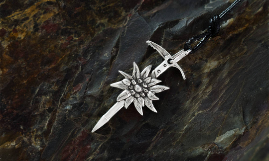 Ice axe and edelweiss pendant